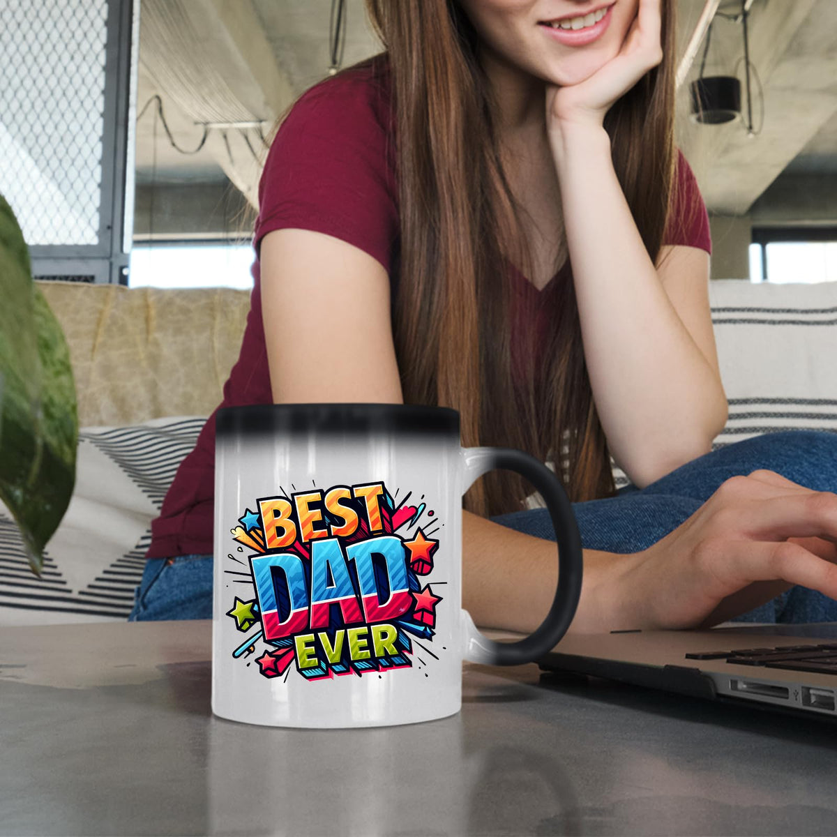 Woman at a laptop with the Best Dad Ever comic colour changing mug