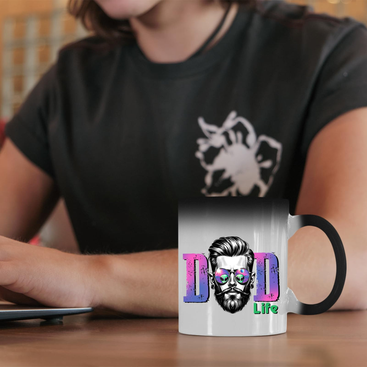 Dad Life bearded dad colour changing mug on a desk beside a laptop
