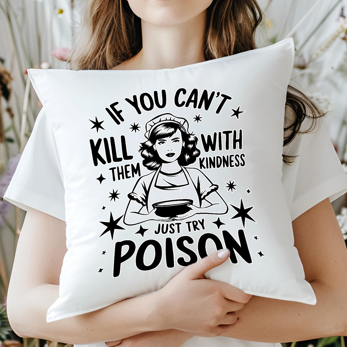 Woman hugging the Just Try Poison cushion