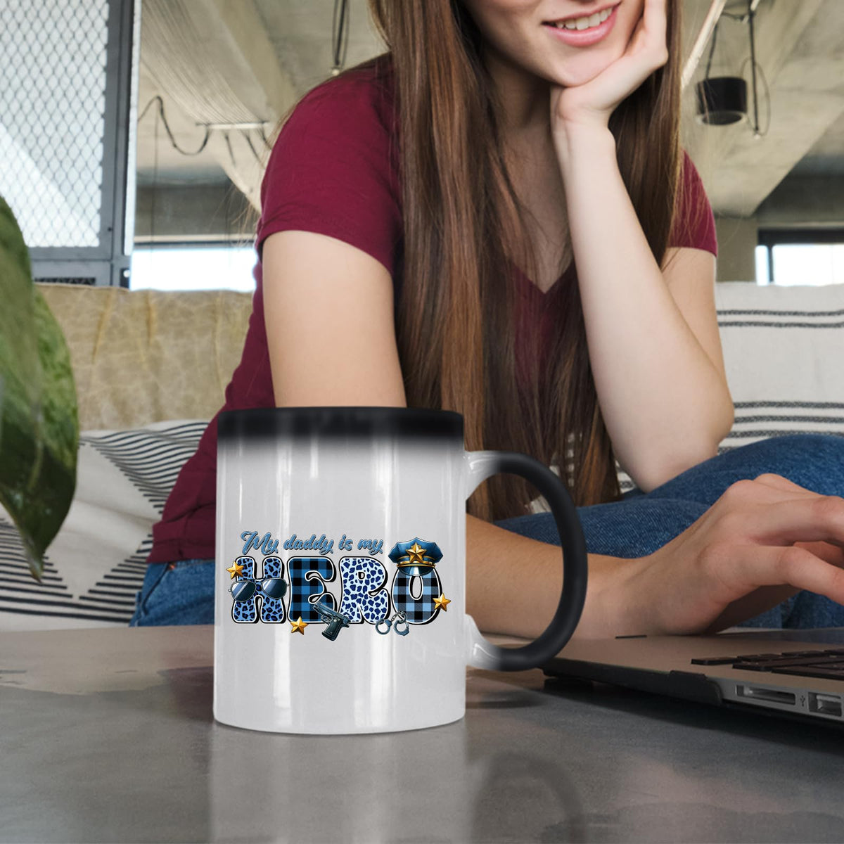 Woman at a laptop with the My Daddy Is My Hero police colour changing mug