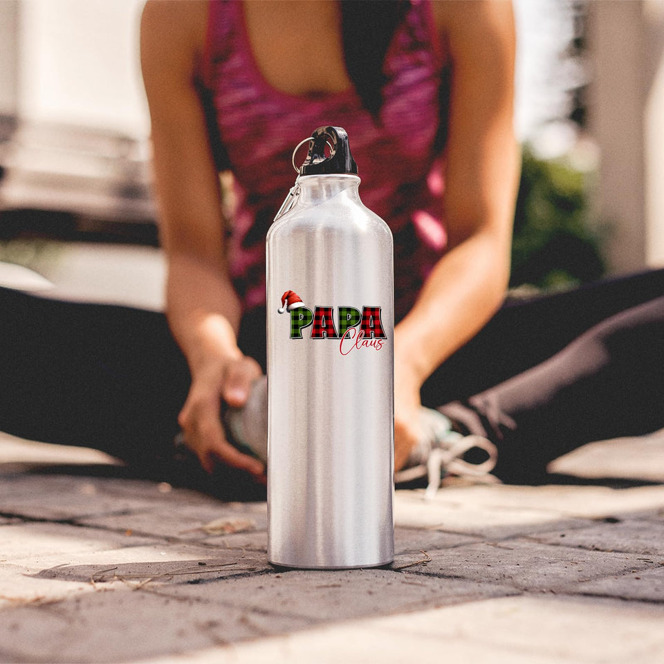 Papa Claus water bottle on the ground as a woman stretches