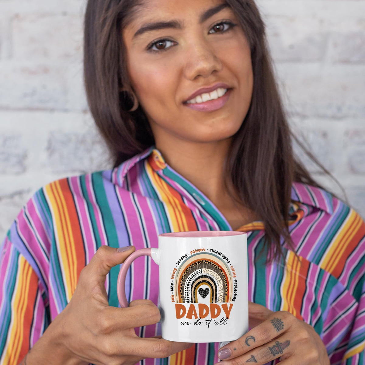 Woman in a striped shirt holding the Daddy boho rainbow colour handle mug