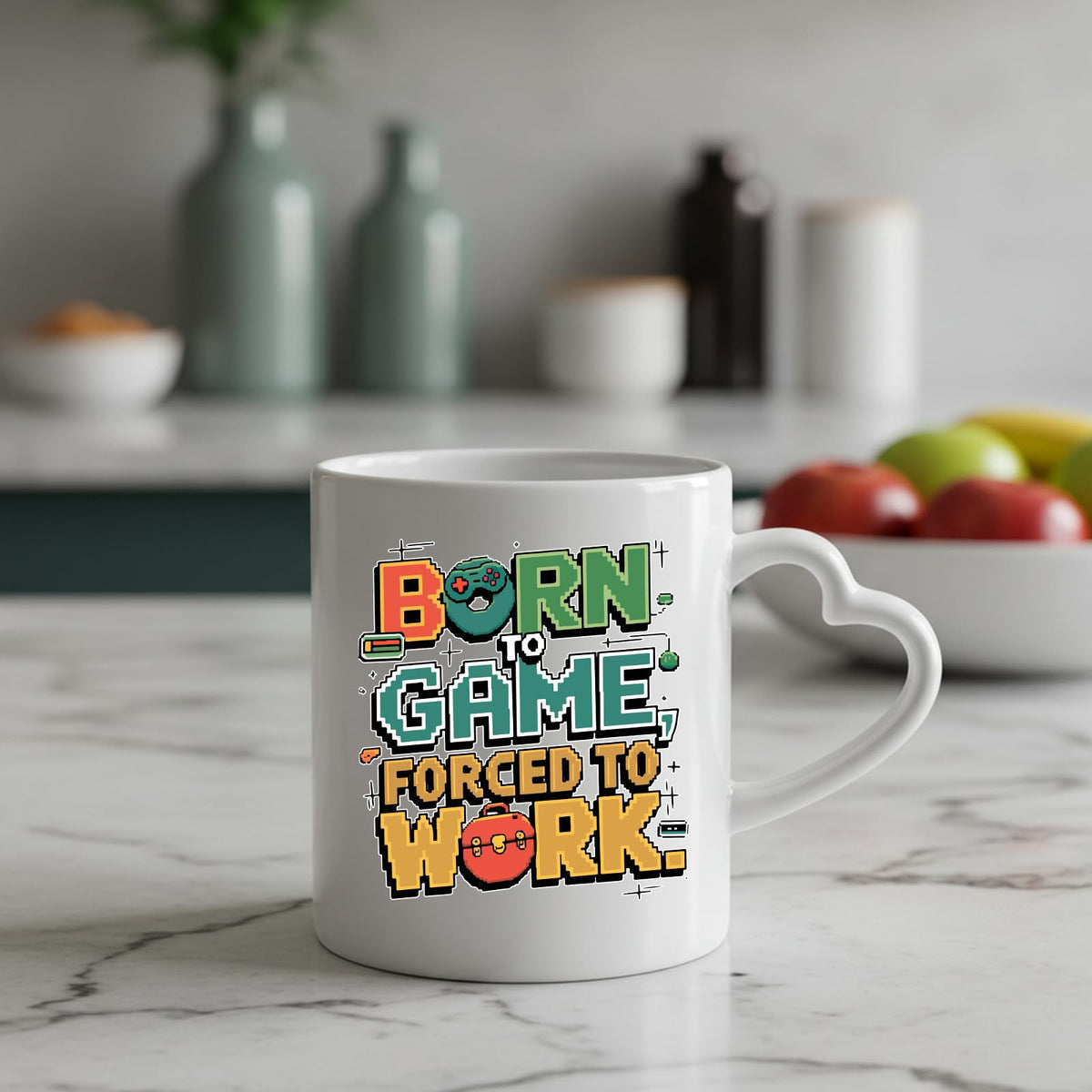 Born to Game heart-handle mug on a marble counter with fruit