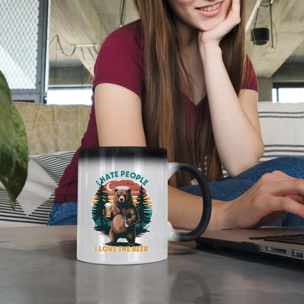 Woman at a laptop with the beer-loving bear colour changing mug