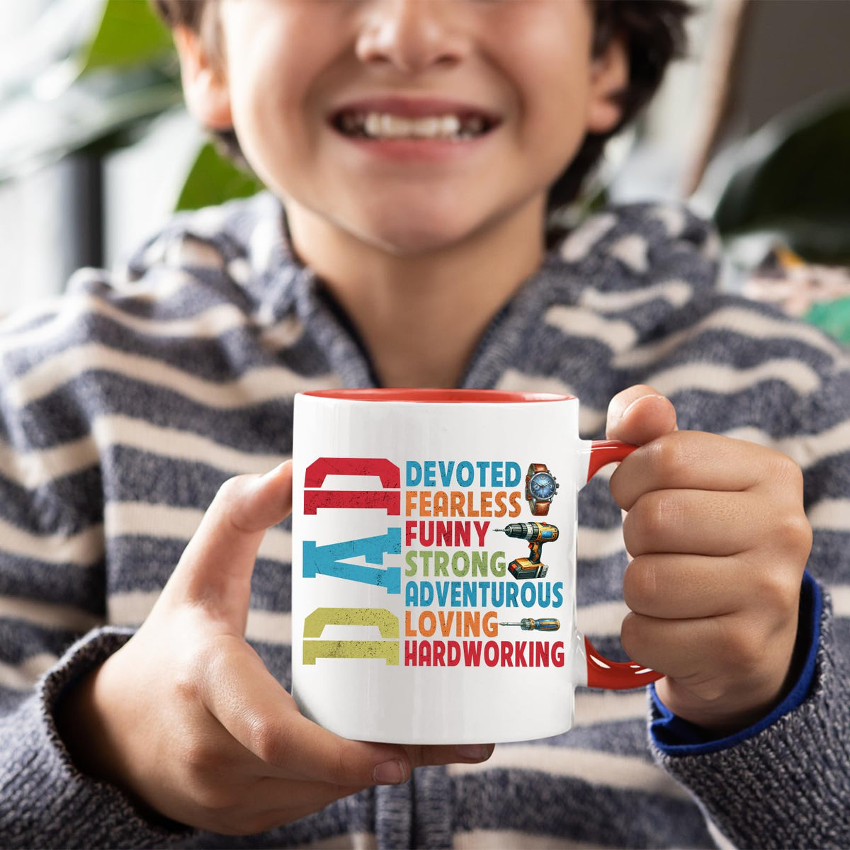 Smiling child holding the DAD Devoted mug with a red handle