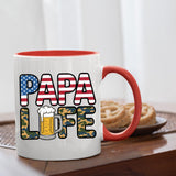 Papa Life mug with a red handle beside biscuits