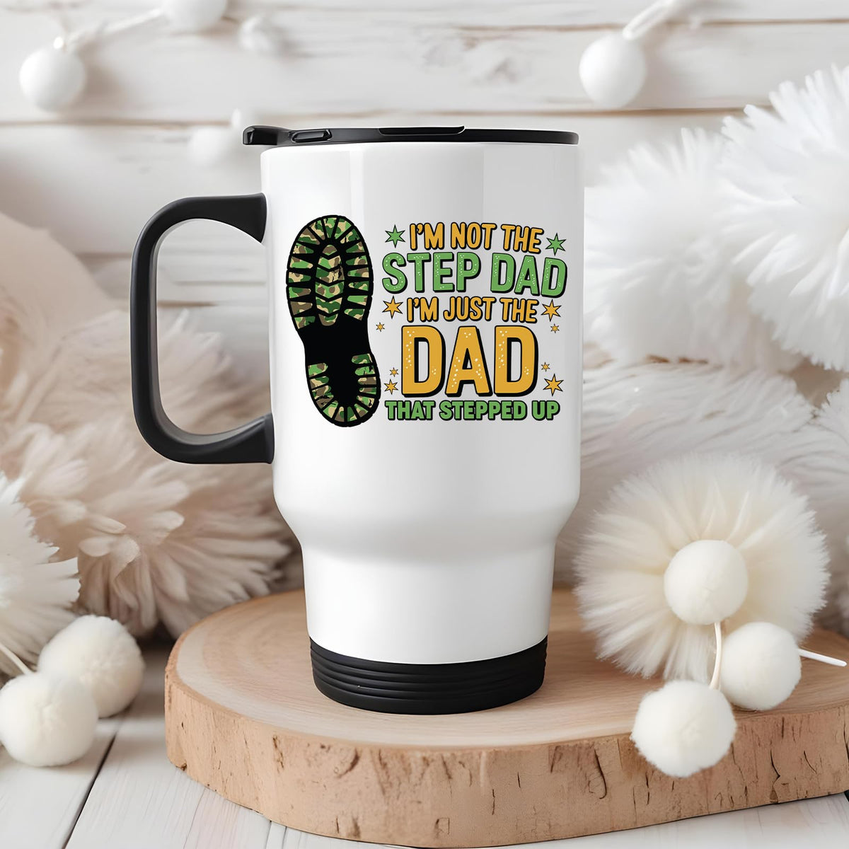 Dad That Stepped Up travel mug on a wooden slice with white pom-poms