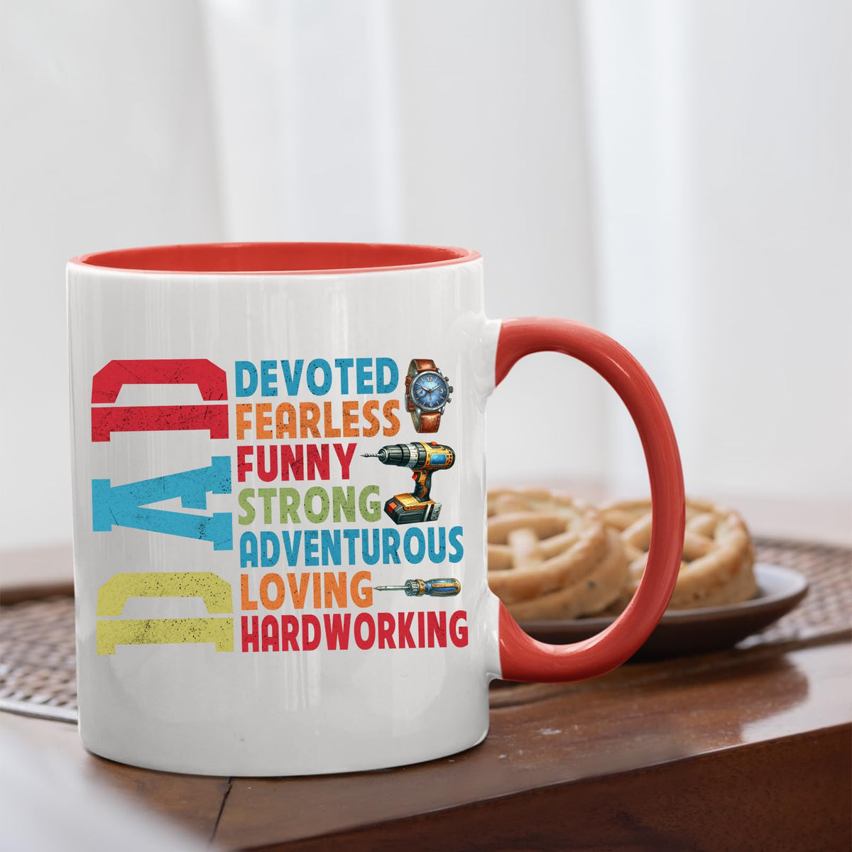 DAD Devoted mug with a red handle beside biscuits