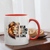 Dad the King lion mug with a red handle beside biscuits