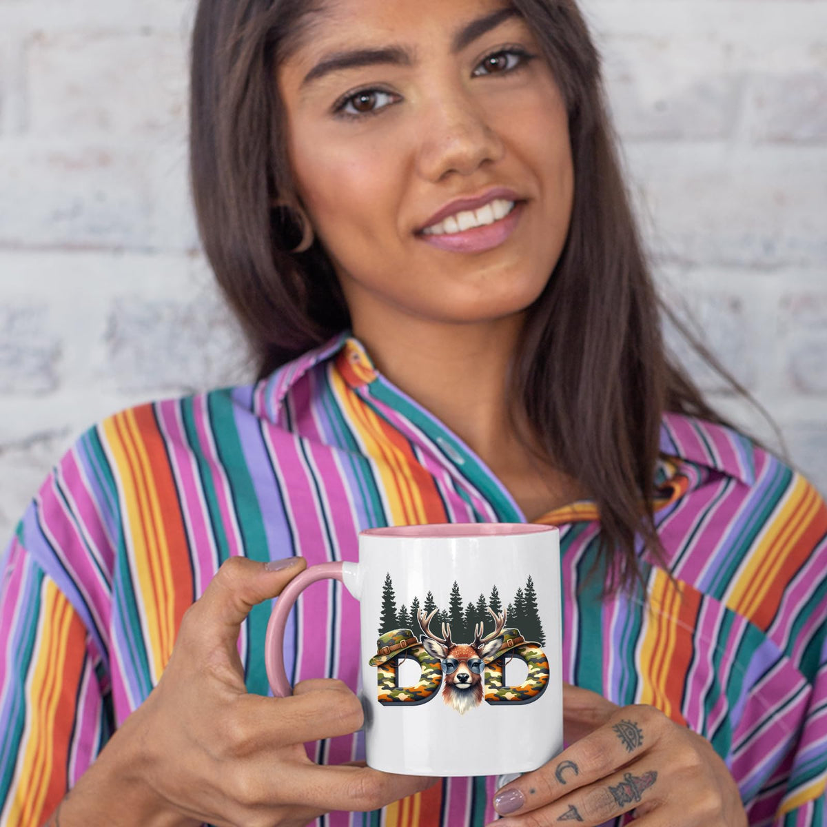 Woman in a striped shirt holding the Hunting Dad deer colour handle mug