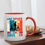 Like Father Like Daughter mug with a red handle beside biscuits