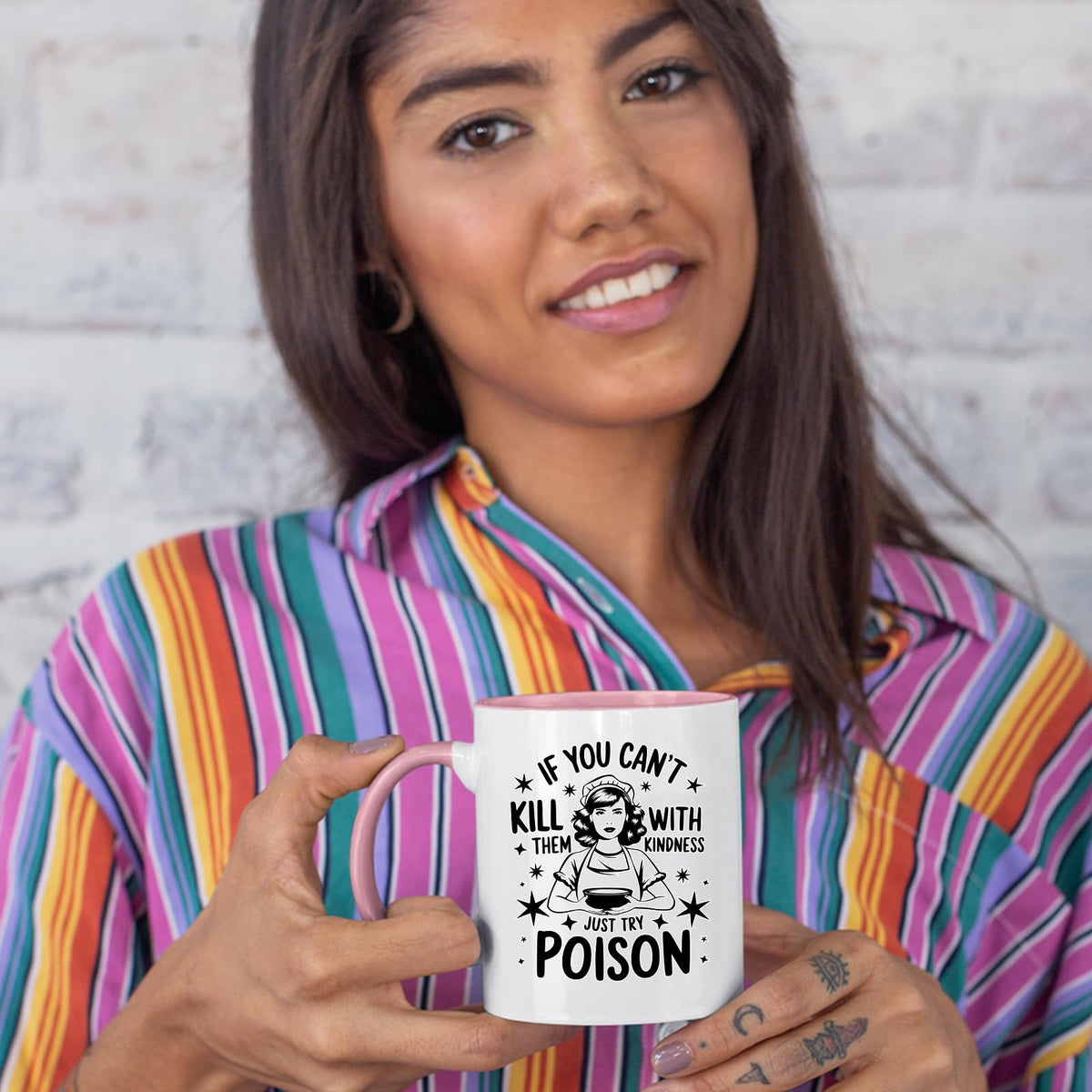 Woman in a striped shirt holding the Just Try Poison colour handle mug