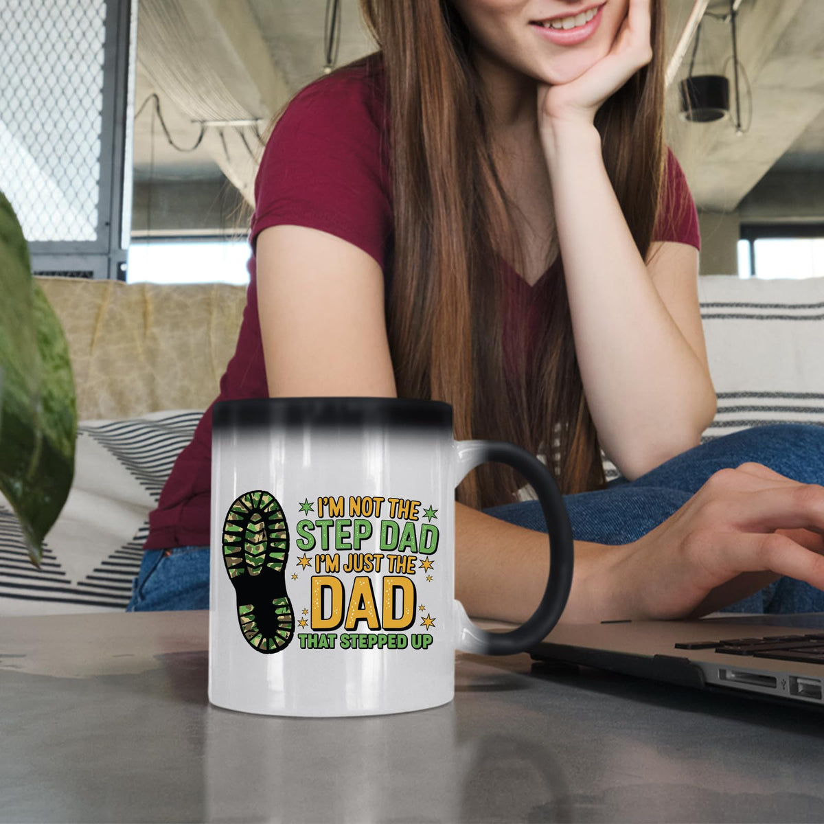 Woman at a laptop with the Dad That Stepped Up colour changing mug