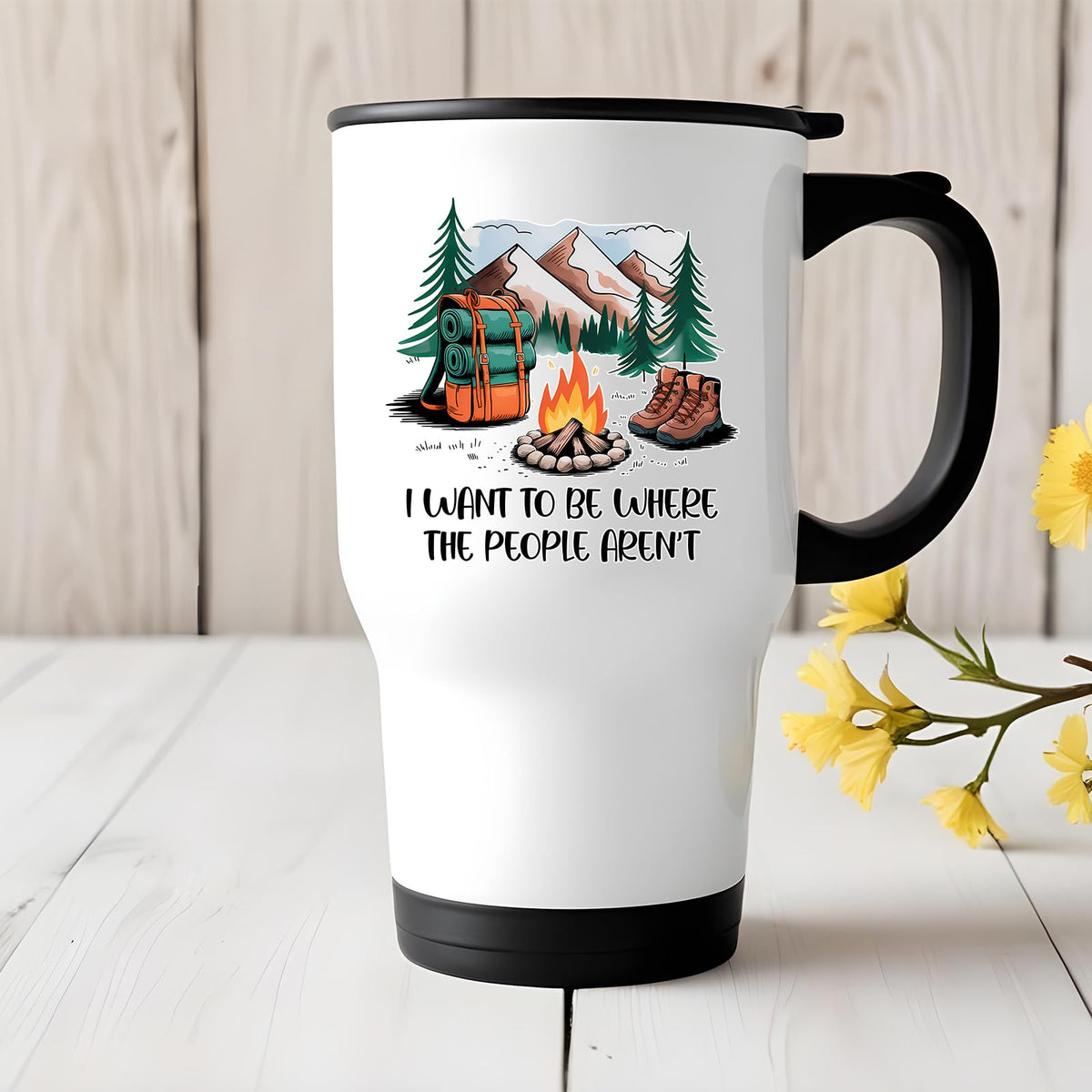 camping escape travel mug on a white wooden table with yellow flowers
