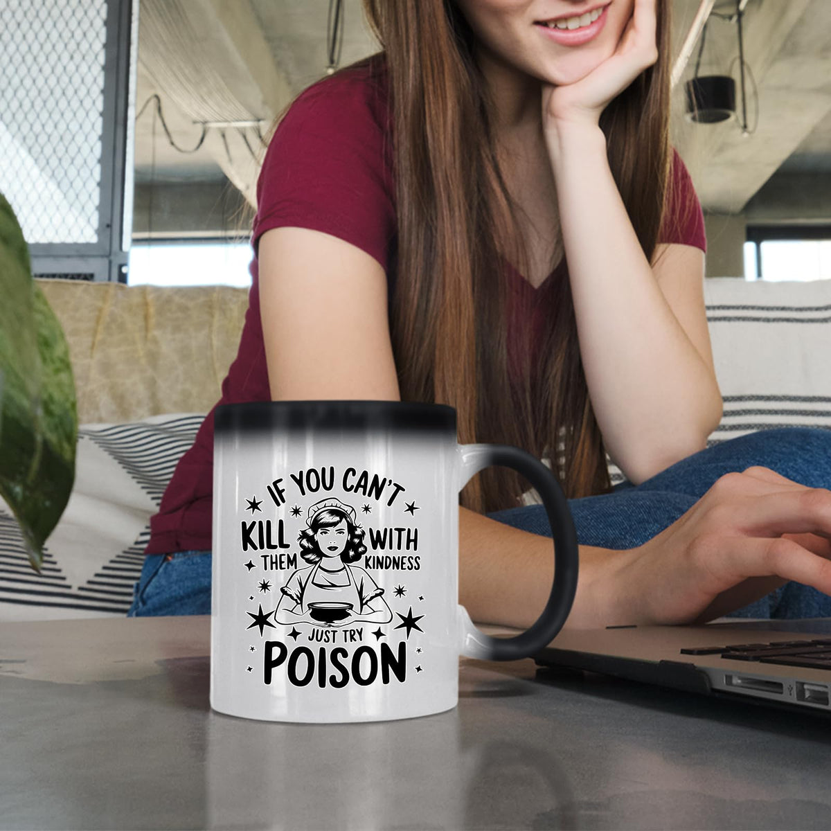 Woman at a laptop with the Just Try Poison colour changing mug