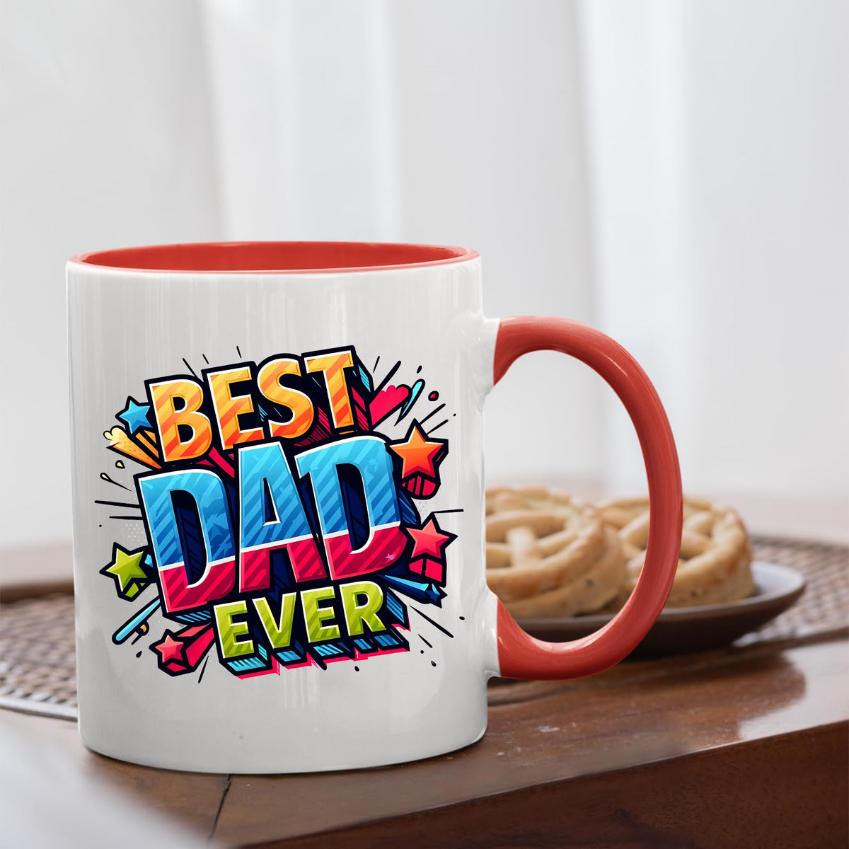 Best Dad Ever comic mug with a red handle beside biscuits