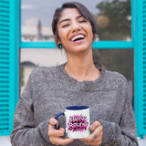 Woman holding the mug with a dark blue handle