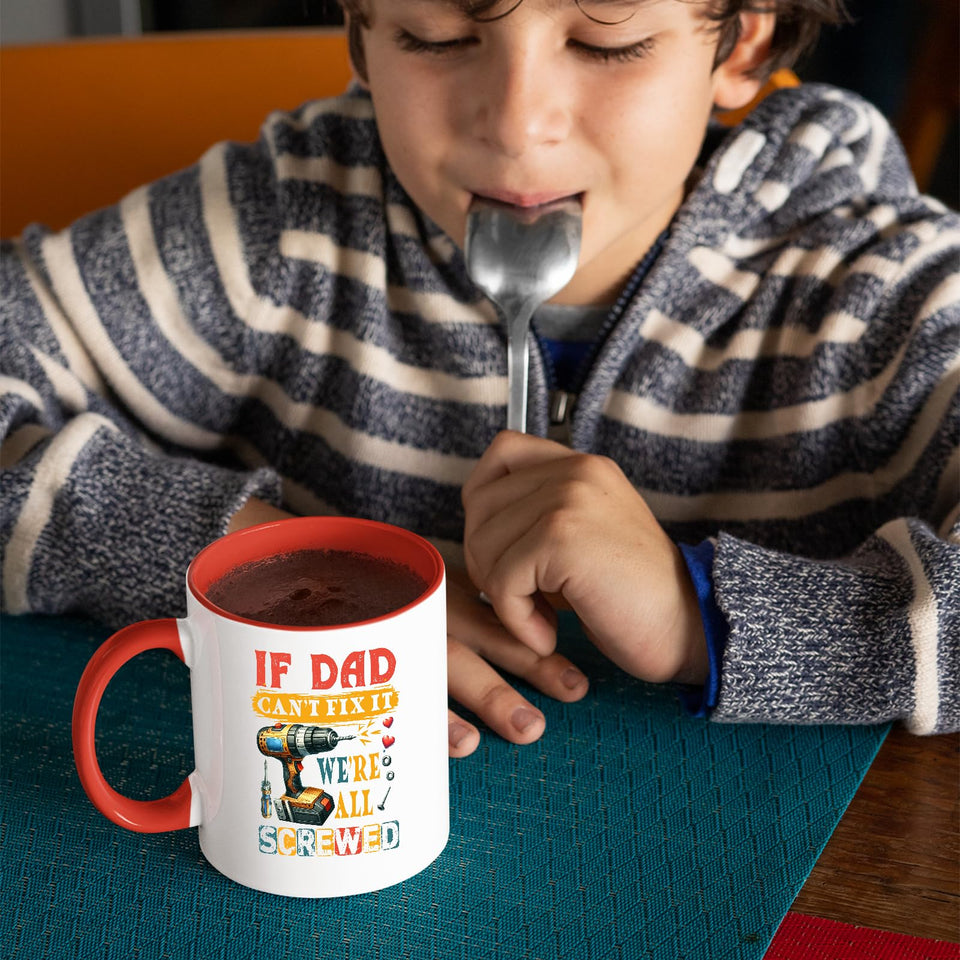 Child with a spoon next to the If Dad Can’t Fix It mug with a red handle