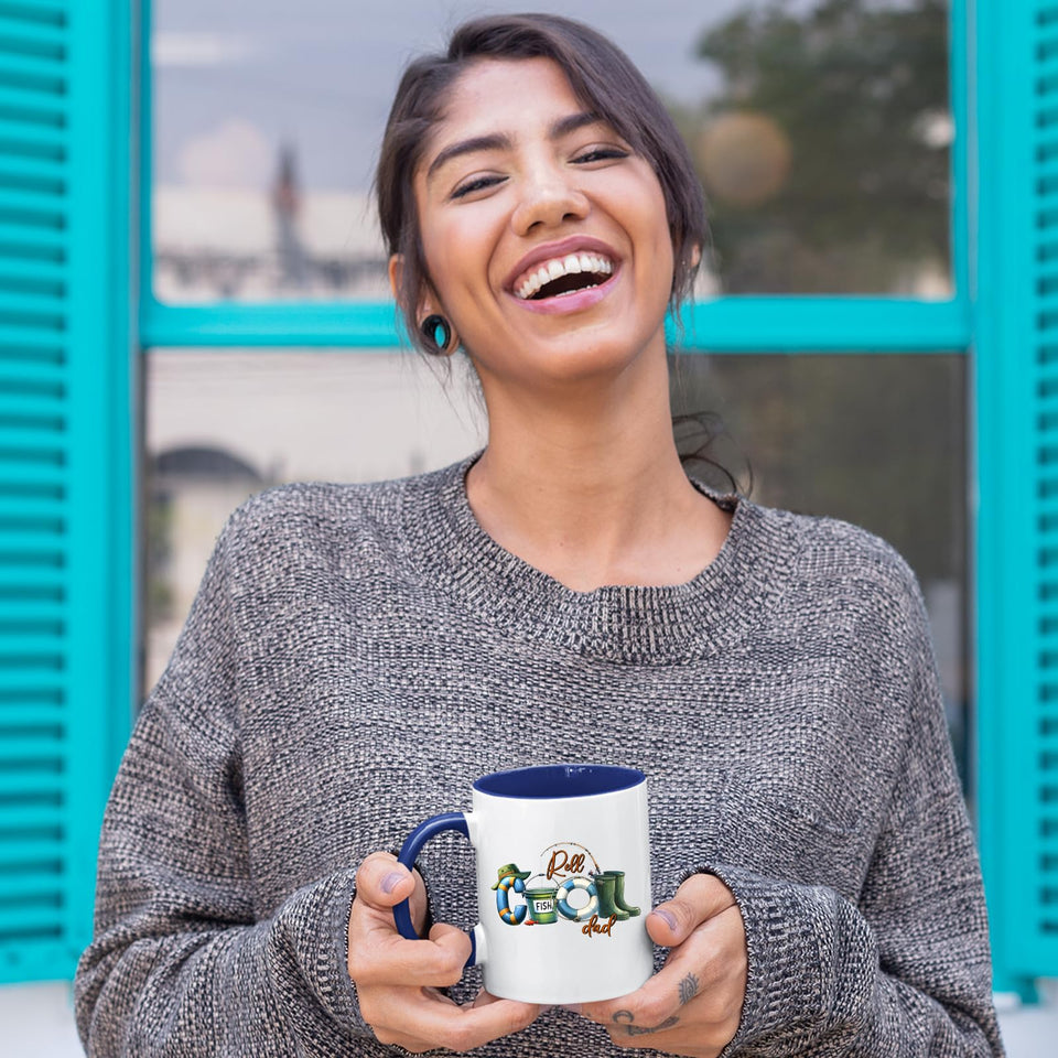 Laughing woman holding the Reel Cool Dad mug with a dark blue handle