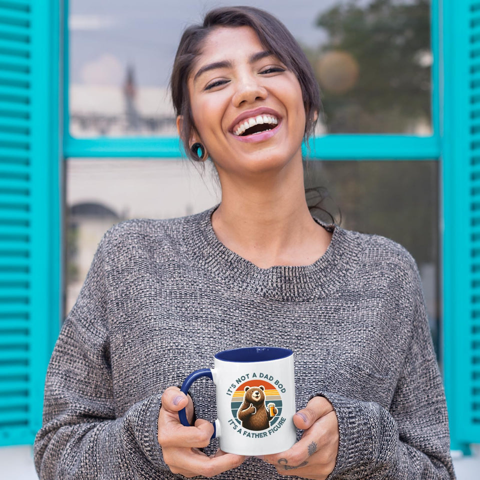 Laughing woman holding the Dad Bod bear mug with a dark blue handle
