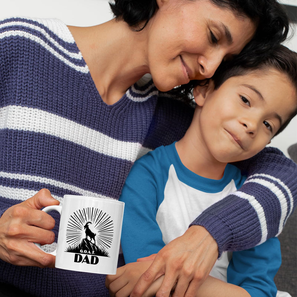 Mum and son with the GOAT Dad mug