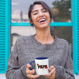 Laughing woman holding the Papa Claus mug with a dark blue handle