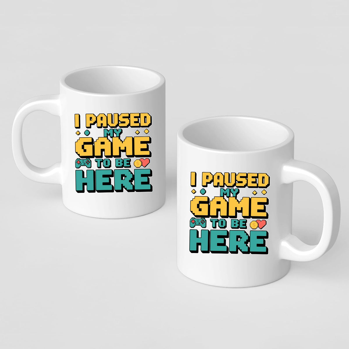 Two I Paused My Game mugs showing the print on both sides