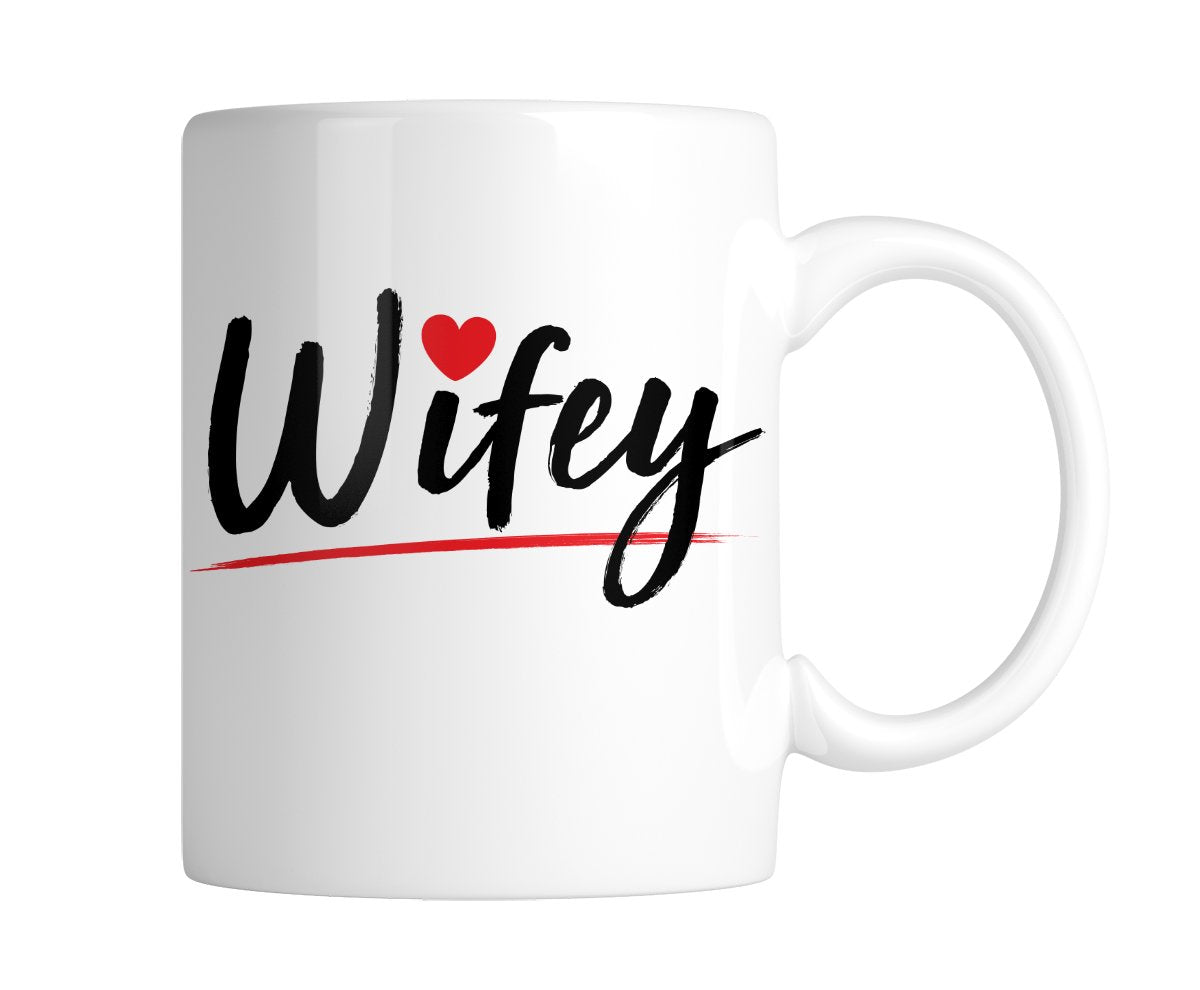 White mug with “Wifey” in black script with a little red heart, handle on the right