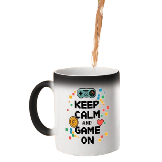 Hot drink poured into the colour changing mug as “Keep Calm and Game On” with a game controller appears