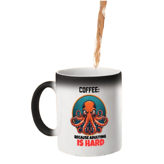 Hot drink poured into the colour changing mug as a grumpy octopus and “Coffee: Because Adulting Is Hard” appears