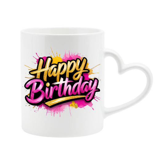White heart-handle mug with pink and purple script “Happy Birthday” lettering