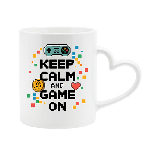 White heart-handle mug with “Keep Calm and Game On” with a game controller