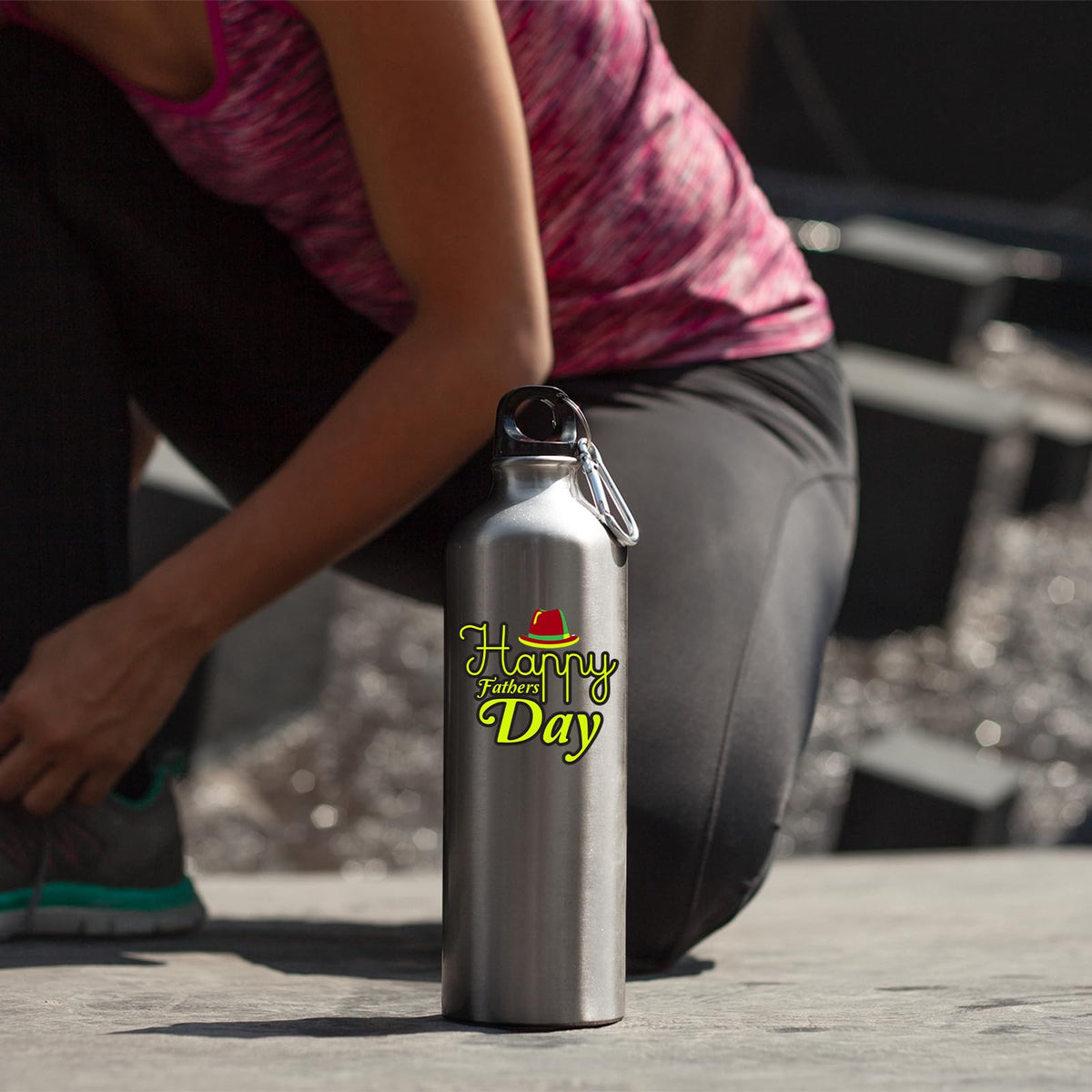 Woman kneeling beside the Father's Day bottle