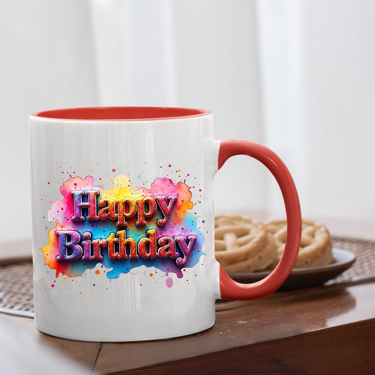 Mug with a red handle beside biscuits