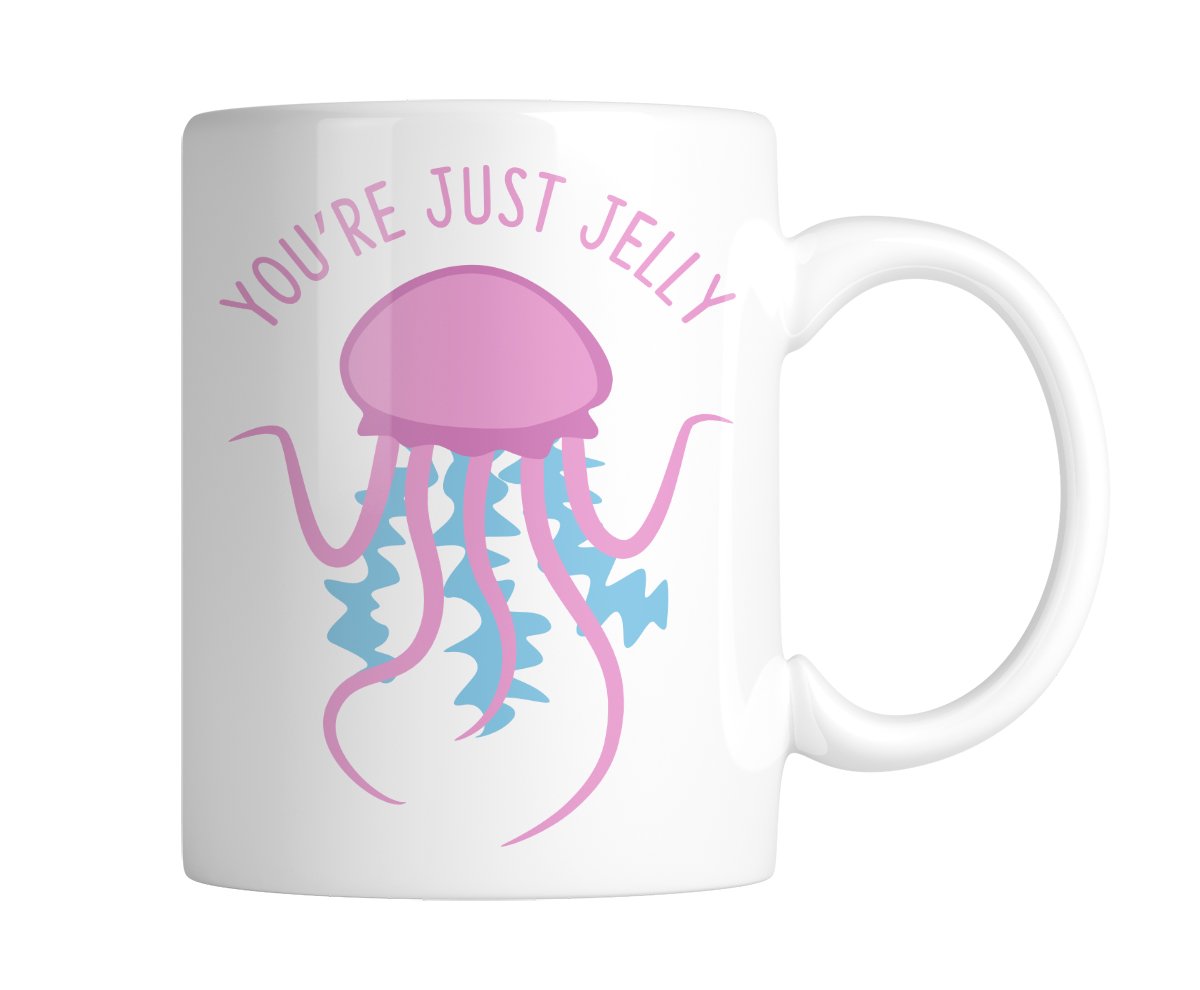 White mug with a pink jellyfish and “You're Just Jelly”, handle on the right
