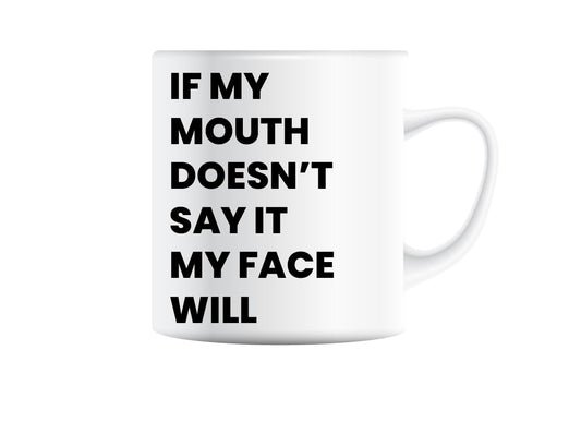 White mug printed with “If My Mouth Doesn't Say It, My Face Will” in bold black capitals