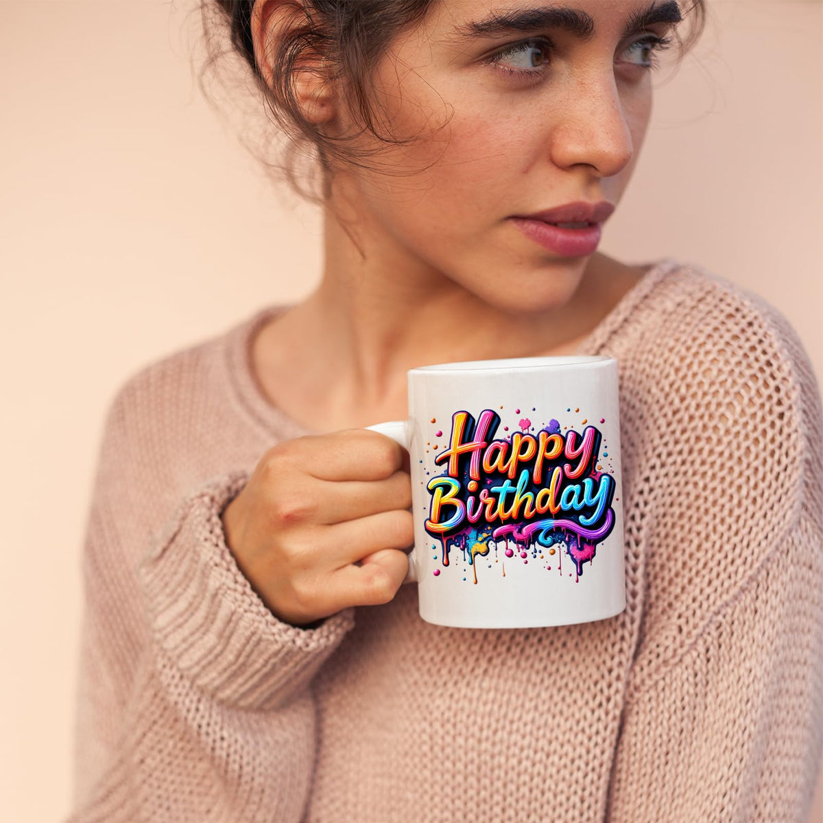 Woman sipping from the Happy Birthday mug