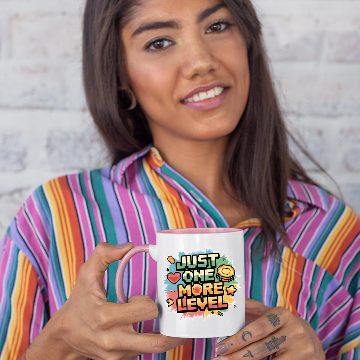 Woman in a striped shirt holding the colour handle mug