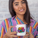 Woman in a striped shirt holding the colour handle mug