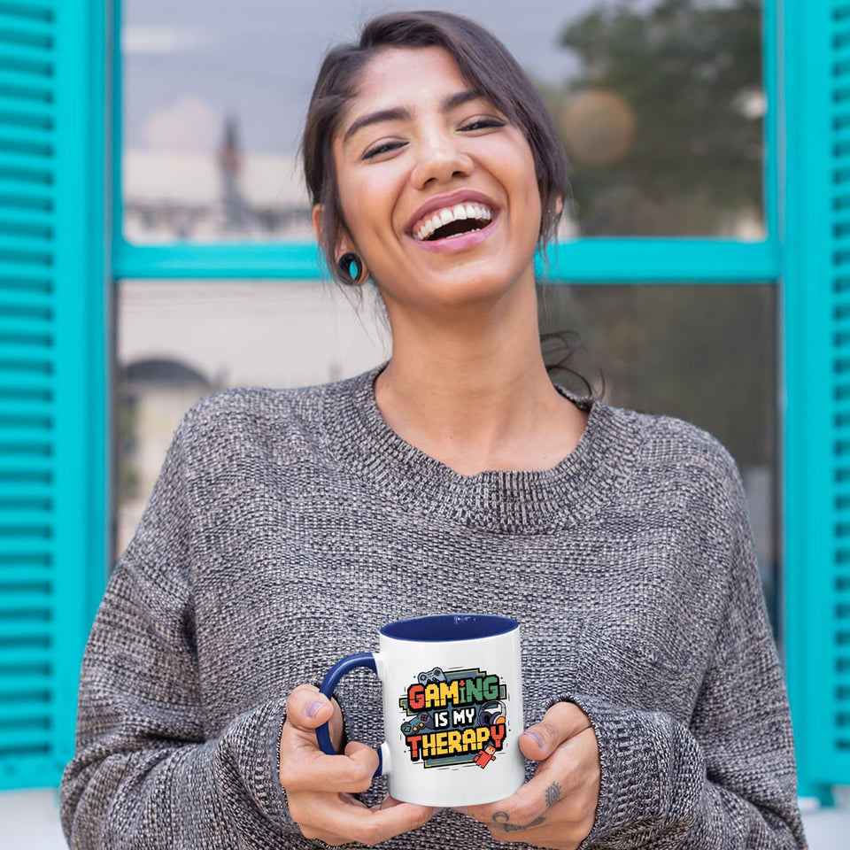 Woman holding the mug with a dark blue handle