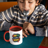 Child drinking from the mug with a red handle