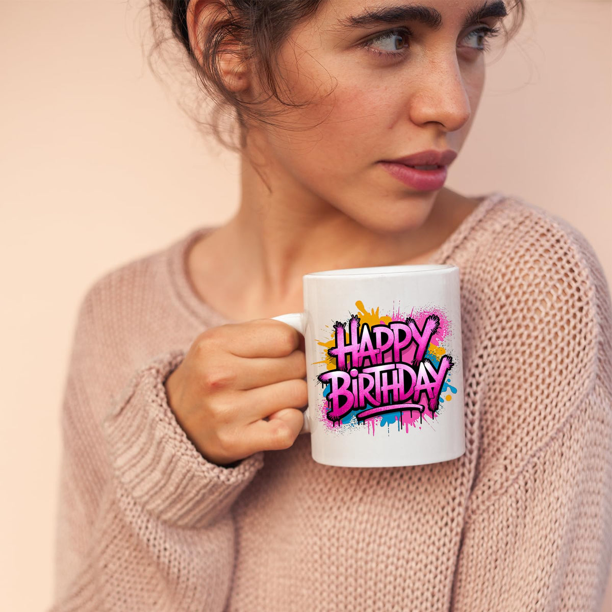 Woman sipping from the Happy Birthday mug