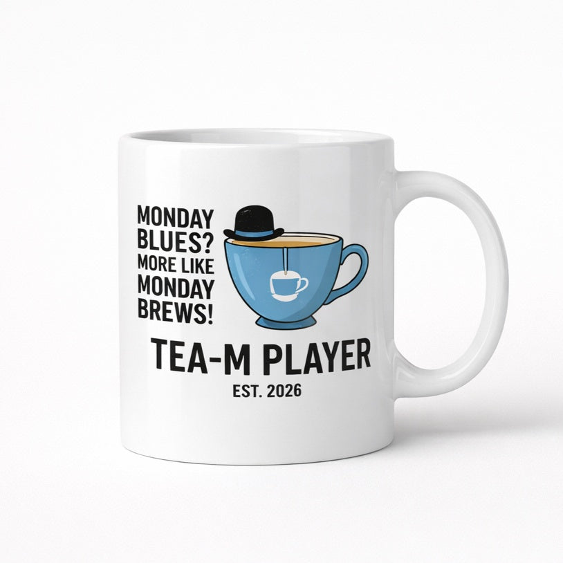 White mug printed “Monday Blues? More Like Monday Brews! – Tea-m Player”